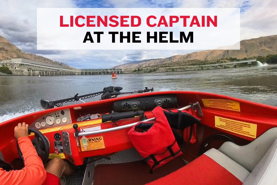 Jet boat captain at the helm steering along the Columbia River in Wenatchee