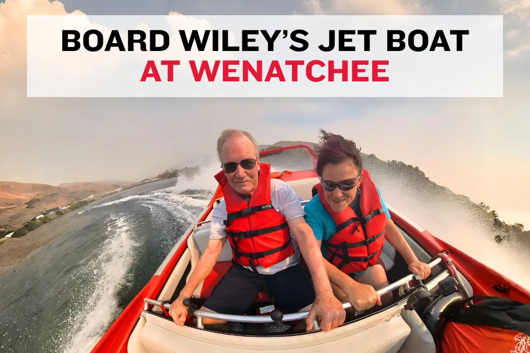 Jet boat tied at a Wenatchee dock with passengers boarding in life jackets.