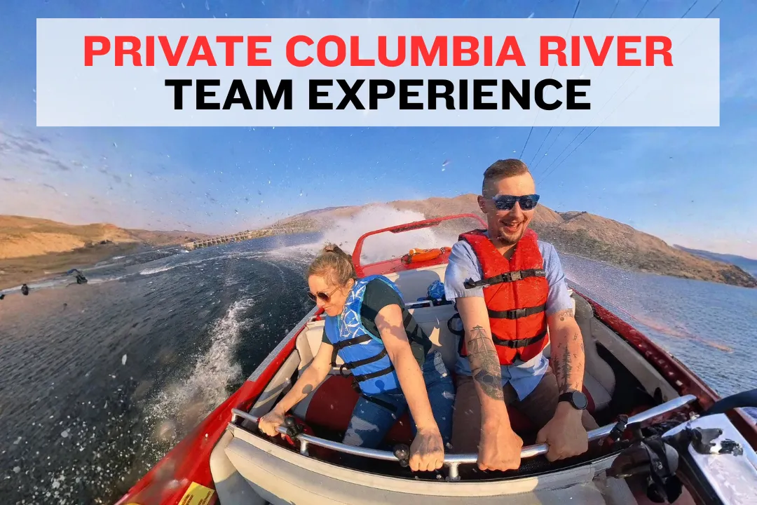 Private jet boat with a small group cruising past Rocky Reach Dam on the Columbia River